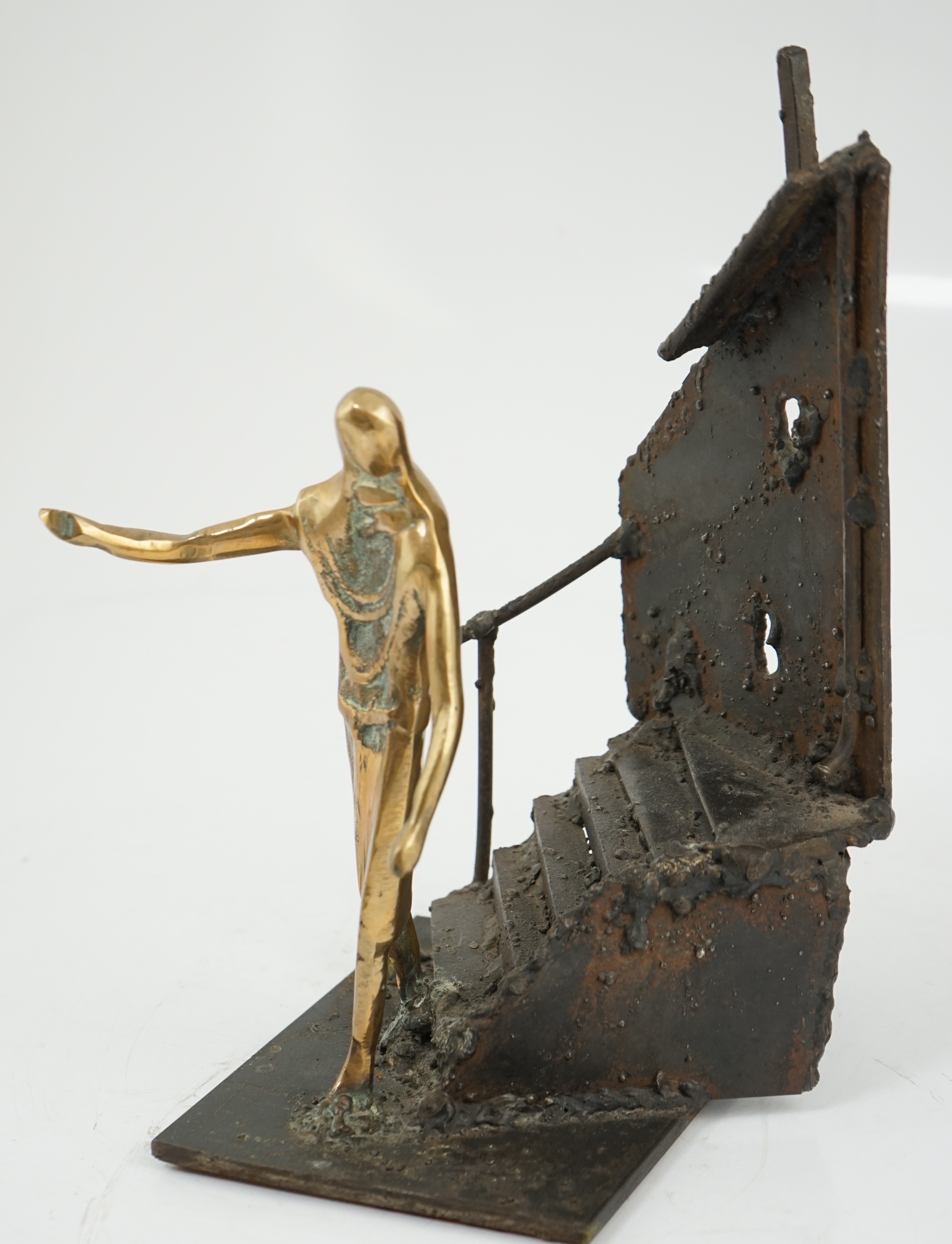 Arthur Dooley (British, 1929-1994), a bronze and iron group of a figure descending a staircase, 19cm wide, 29cm high